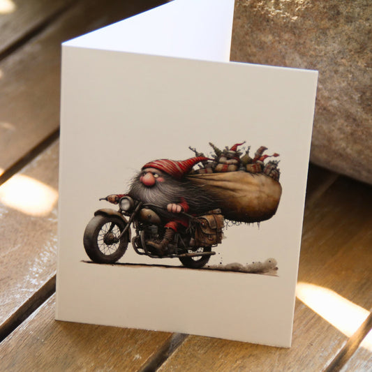 Carte de vœux pliée en deux avec illustration de Père Noël à moto