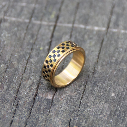 Bague acier inox rotative damier course moto GP finition doré et noir