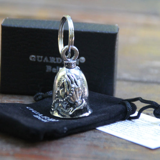 Guardian Bell Mains en prière, mains jointes et chapelet avec croix, en étain avec sa pochette en velours noir et sa carte de la légende